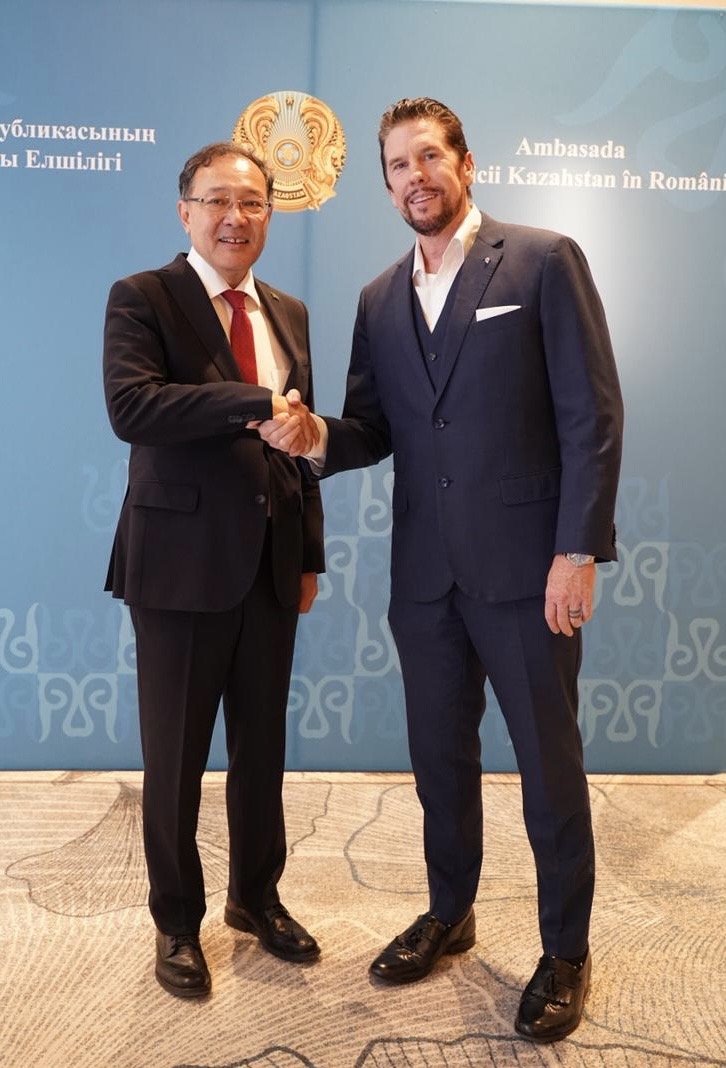 Dr. Wilkens shaking hands with the Kazakh Ambassador in Romania