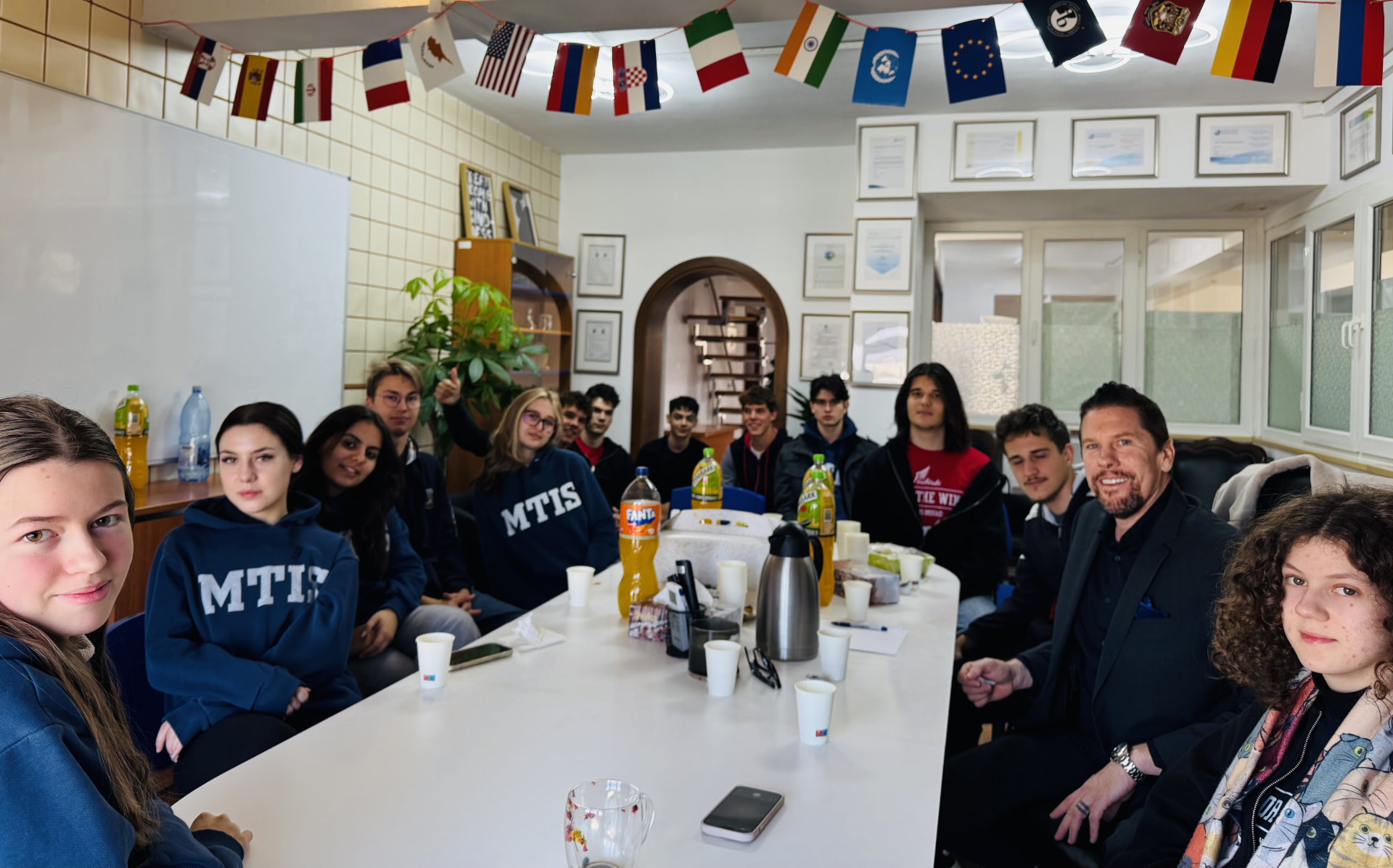 Dr. Wilkens meeting with student council members around a table