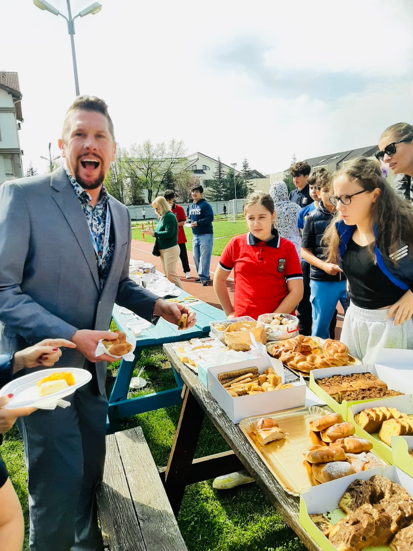 Dr. Wilkens visiting a student-led outdoor bake sale